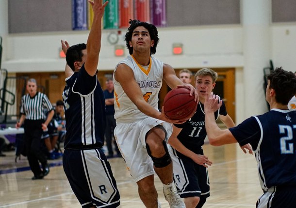 Lemoore's Zach Burke drive to the basket in Thursday's home game against Redwood High School. The Tigers lost 69-60.